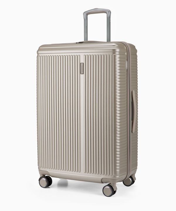 Duża walizka na kółkach szampańska