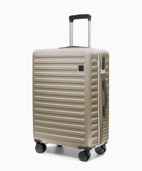 Walizka średnia na kółkach z poliwęglanu szampańska