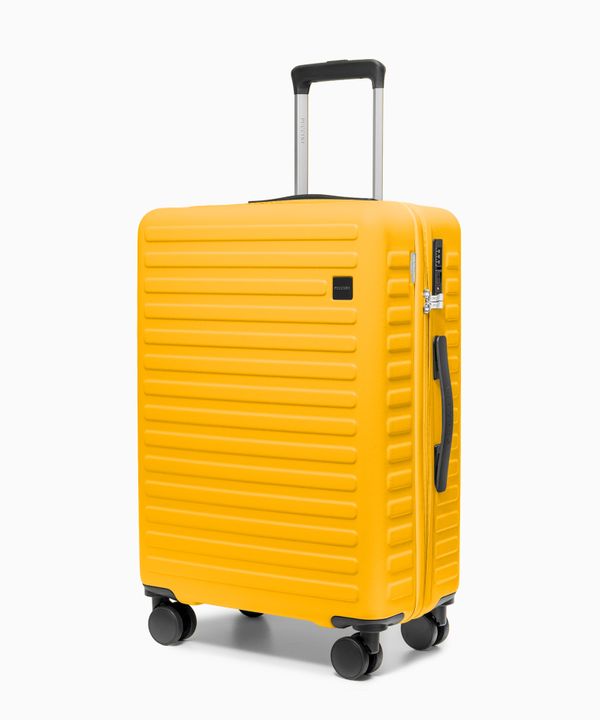 Walizka średnia na kółkach z poliwęglanu żółta
