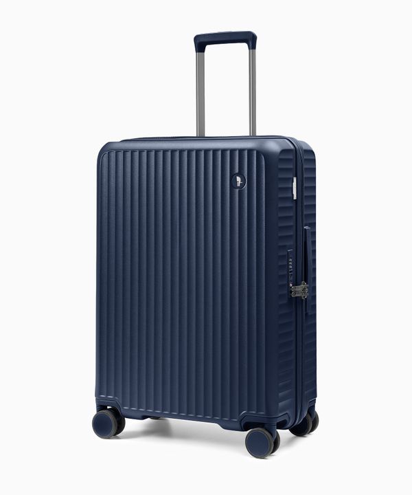 Walizka średnia z poliwęglanu na czterech kołach granatowa