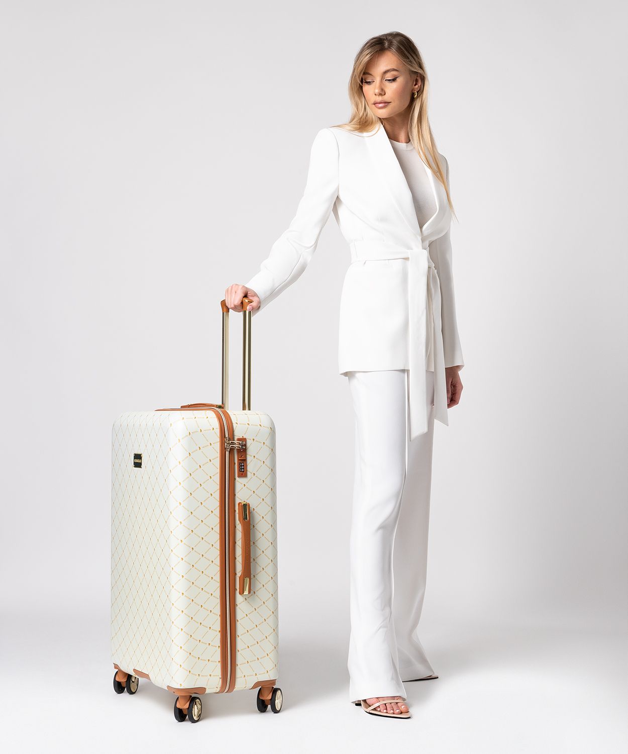 Duża beżowa walizka monogram