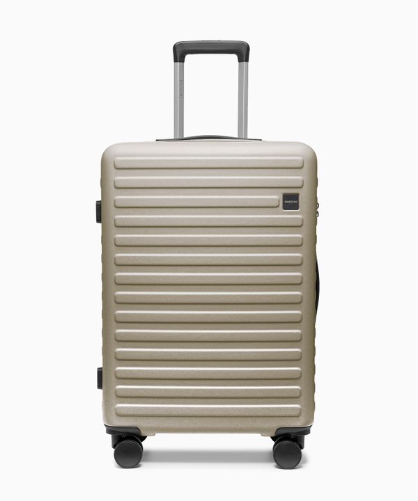 Walizka średnia na kółkach z poliwęglanu szampańska