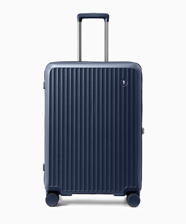 Walizka średnia z poliwęglanu na czterech kołach granatowa