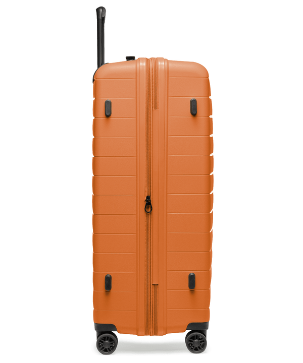 Walizka duża z poszerzeniem z polipropylenu pomarańczowa