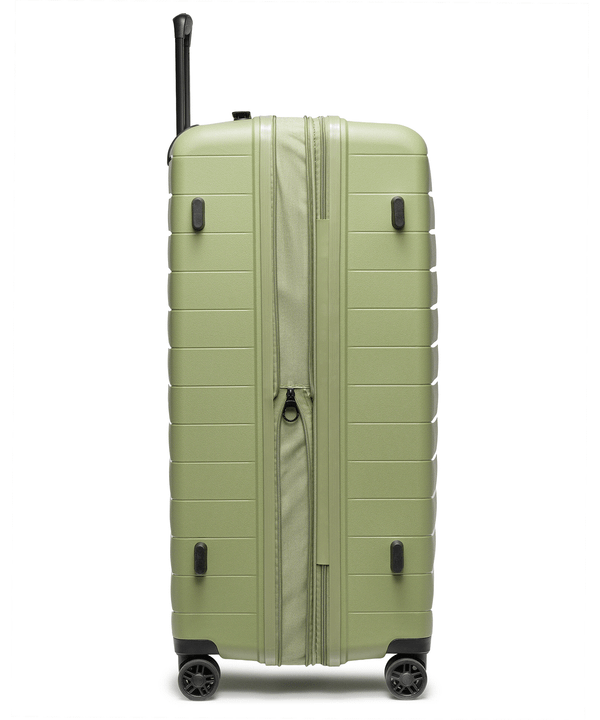 Walizka średnia z poszerzeniem z polipropylenu zielona